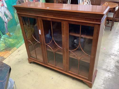 A reproduction mahogany three door bookcase, width 135cm dep...