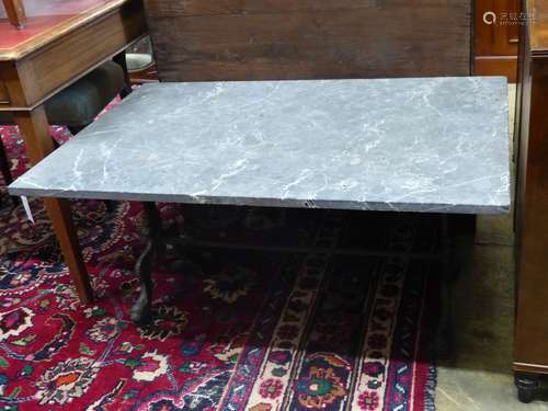 A rectangular marble top cast iron coffee table, width 108cm...