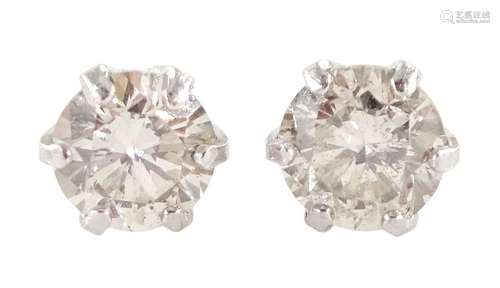 Pair of platinum round brilliant cut diamond stud earrings