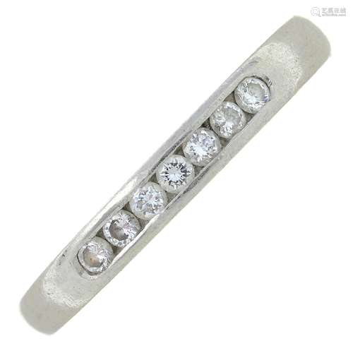 A platinum diamond half eternity ring.Estimated total diamon...