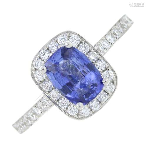 A sapphire and diamond cluster ring.Sapphire weight 1.15cts.