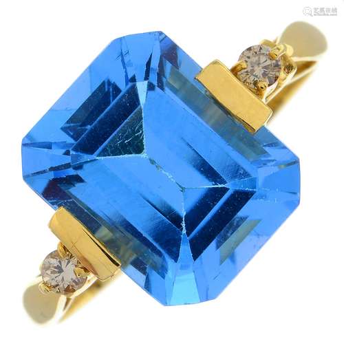 A blue topaz and brilliant-cut diamond dress ring.Topaz weig...