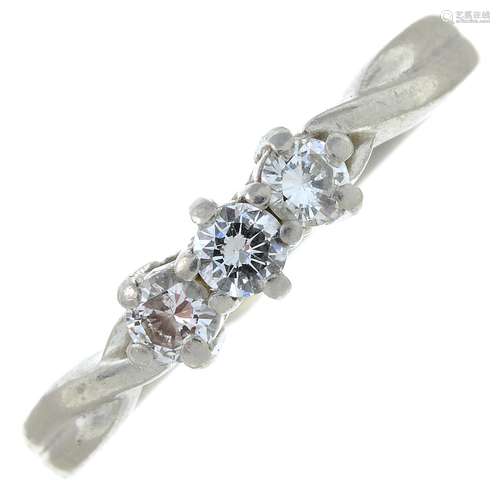 A platinum brilliant-cut diamond three-stone ring.Estimated ...