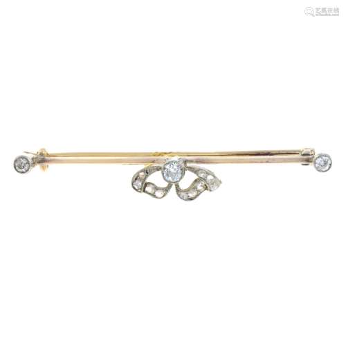 An early 20th century gold vari-cut diamond bar brooch.Estim...