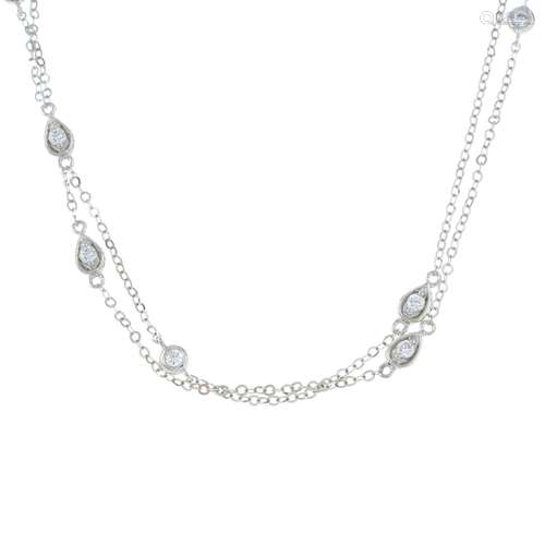 An 18ct gold two-row necklace, with diamond spacers.Total di...