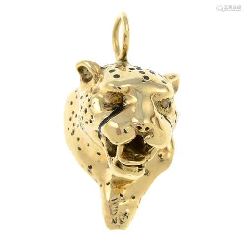 A leopard head pendant, with orange gem eyes.Length 3cms.