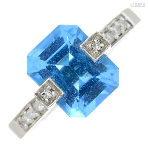 A blue topaz and diamond dress ring.Blue topaz calculated we...