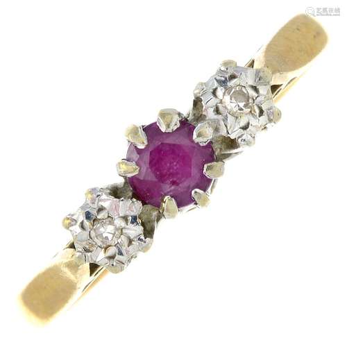 A 9ct gold ruby and diamond three-stone ring.Hallmarks for 9...