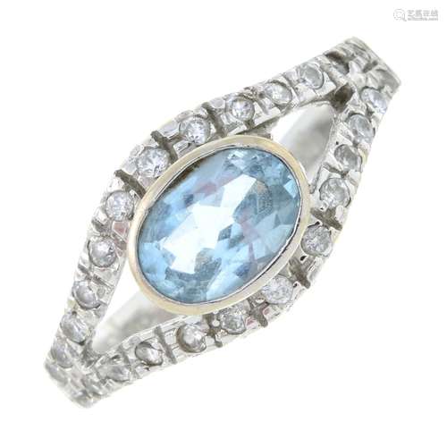 An aquamarine and cubic zirconia ring.Stamped 750.