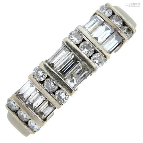 A baguette and brilliant-cut diamond ring.Estimated total di...