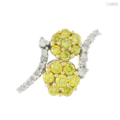 A 9ct gold diamond and yellow diamond dress ring.Estimated t...