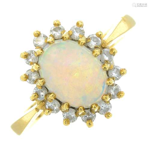 An 18ct gold opal and brilliant-cut diamond cluster ring.Est...