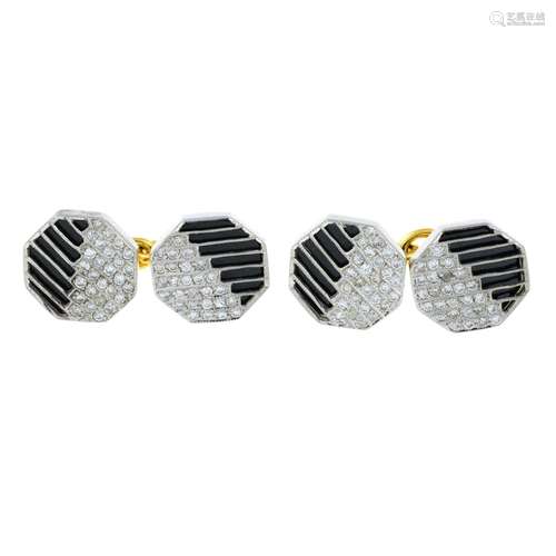 A pair of diamond and onyx cufflinks.Estimated total diamond...