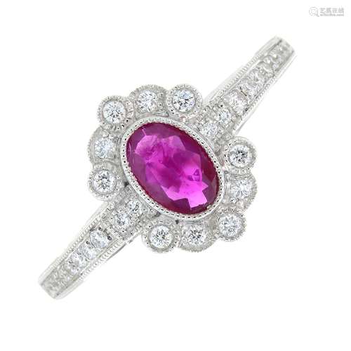 An 18ct gold ruby and diamond cluster ring.Ruby weight 0.41c...