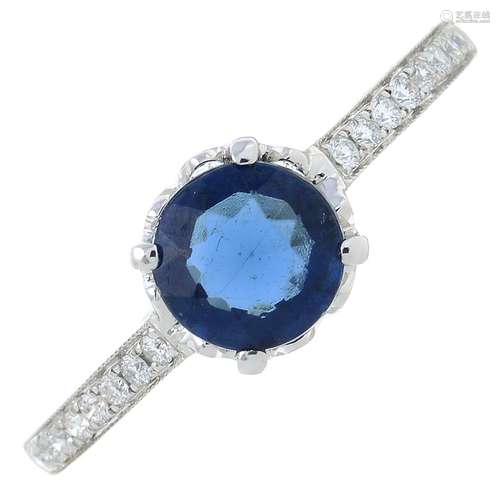 A synthetic sapphire and diamond dress ring.Total diamond we...