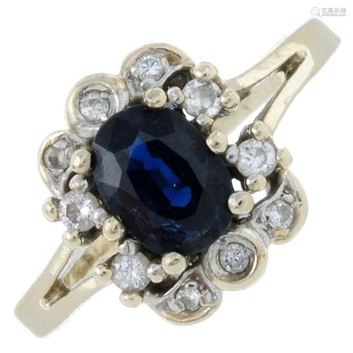 A sapphire and brilliant-cut diamond cluster ring.Stamped 58...