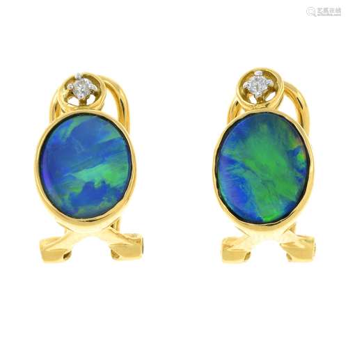 A pair of boulder opal and diamond stud earrings.Stamped 750...