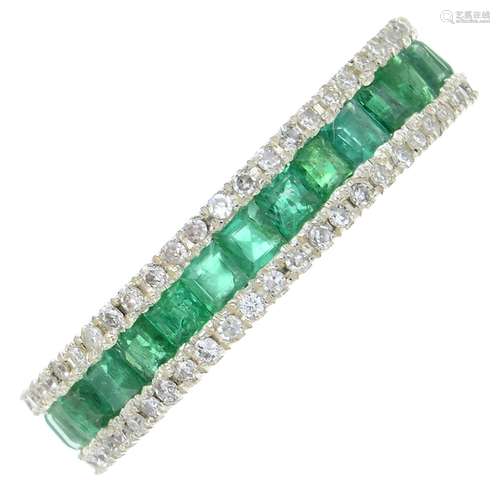 An emerald and diamond full eternity ring.Estimated total di...