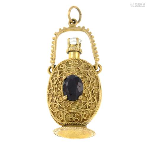 A bottle pendant, with garnet and colourless gem accent.Leng...