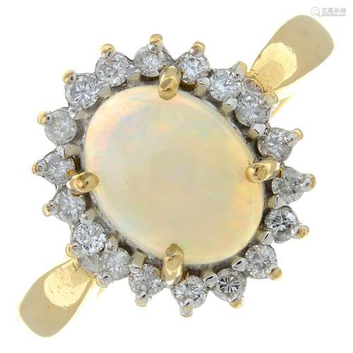 A 9ct gold opal and brilliant-cut diamond cluster ring.Estim...