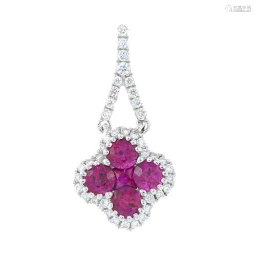 An 18ct gold ruby and diamond quatrefoil cluster pendant.Tot...