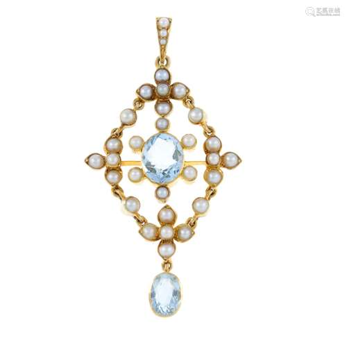 An early 20th century gold aquamarine and split pearl pendan...