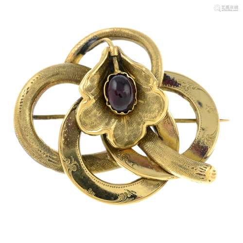 A late 19th century gold floral brooch, with garnet highligh...