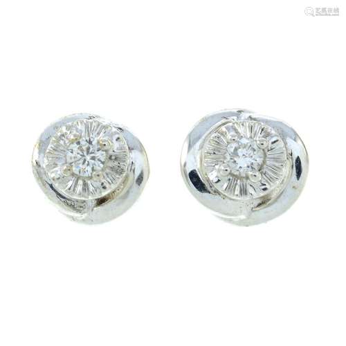 A pair of 9ct gold brilliant-cut diamond stud earrings.Total...