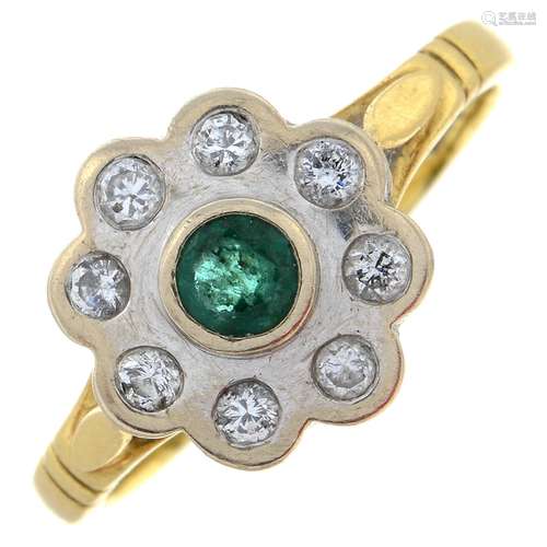 An 18ct gold emerald and brilliant-cut diamond cluster ring....