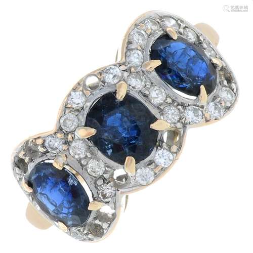 A sapphire and diamond three-stone cluster ring.