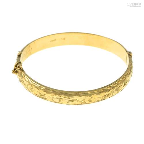 A 9ct gold engraved hinged bangle.Hallmarks for Birmingham.I...