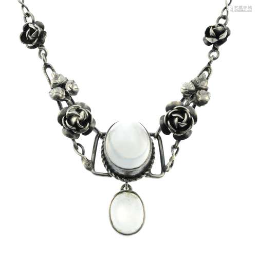 An Arts and Crafts silver moonstone and rose necklace.Length...