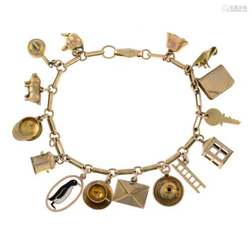 An early 20th century gold charm bracelet, suspending fiftee...