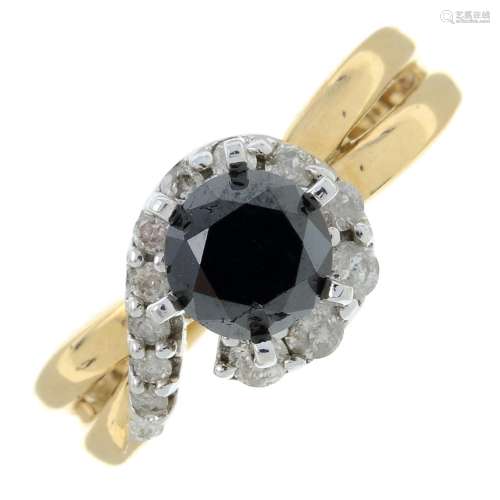 A black gem and brilliant-cut diamond dress ring.Estimated t...