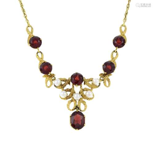 A 9ct gold garnet and seed pearl necklace.Hallmarks for Birm...