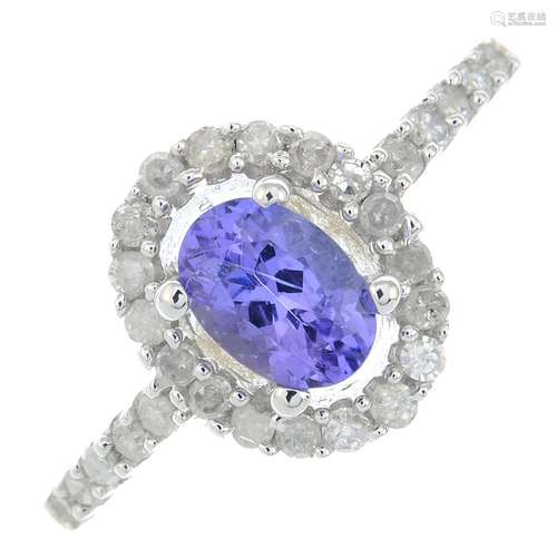 A 9ct gold tanzanite and diamond cluster ring.Estimated tota...