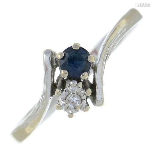 A sapphire and diamond crossover ring.Stamped 585.