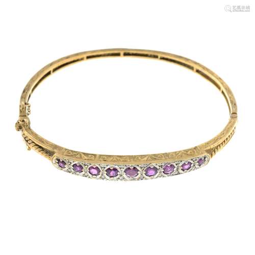 A ruby and diamond bangle.Estimated total diamond weight 0.1...