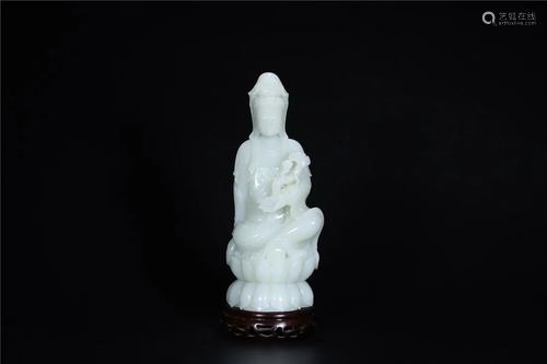 A Chinese White Jade Figure Of Guanyin