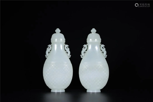 A Chinese White Jade Vase With Cover