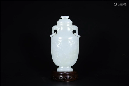 A Chinese White Jade Vase With Cover