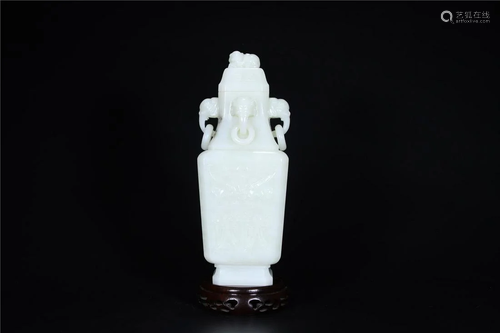 A Chinese White Jade Vase With Cover