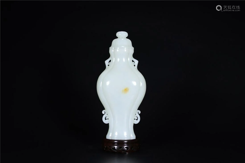 A Chinese White Jade Vase With Cover