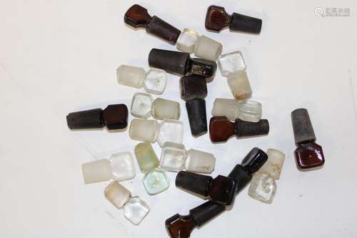 A selection of antique poison bottle and perfume bottle stop...