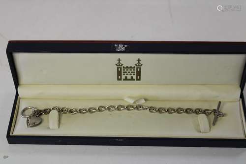 A Royal Mint diamond & sapphire pendant & silver T Bar chain...