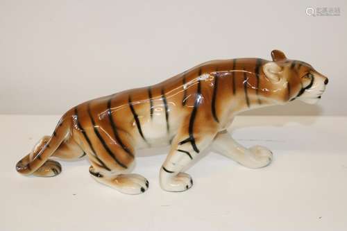 A large Royal Dux tiger figurine with lozenge to base 36x18c...