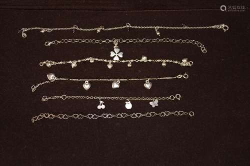 Five Sterling silver charm bracelets & one ankle chain