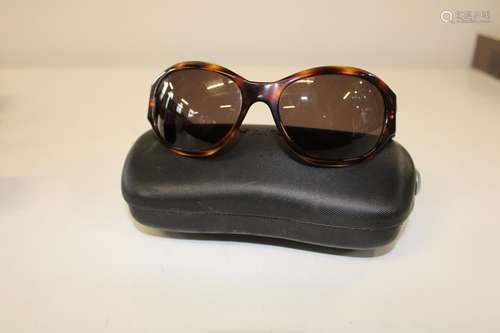 A pair of Chanel tortoise shell oversized sunglasses in the ...