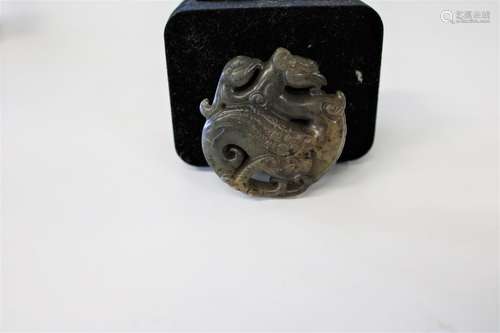 A Oriental carved jade amulet 5cm