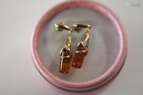 A pair of heavy 9ct gold & amber drop earrings